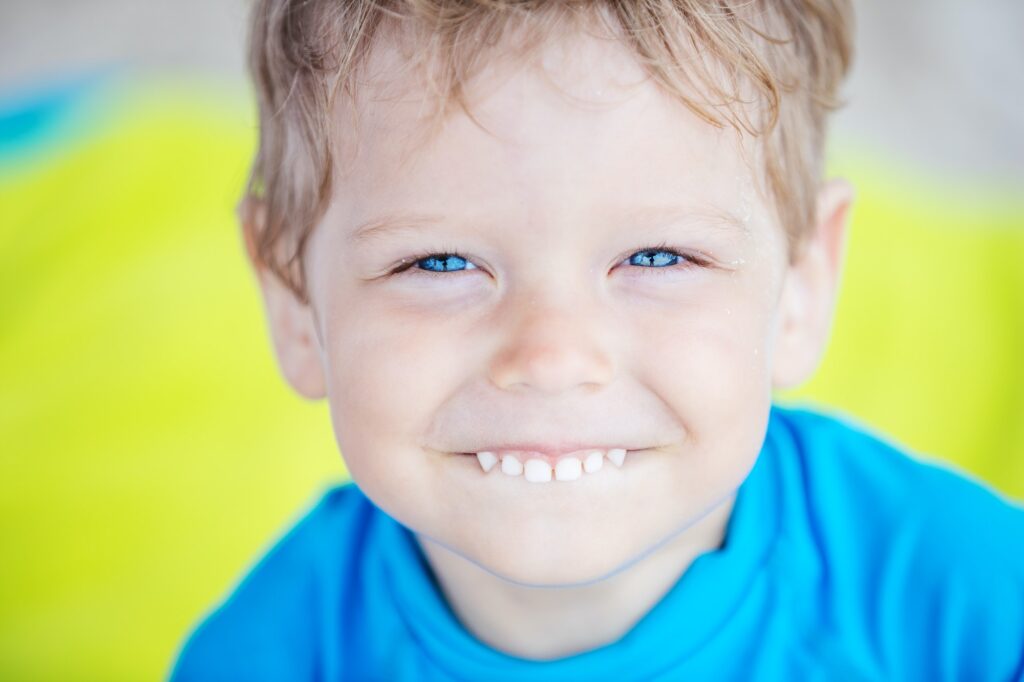 Smiling little boy on the beach